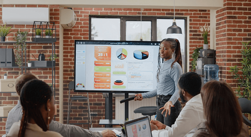 Why Strong Science Isn't Enough - Biotech Partnership Strategy Guide Cover Professional presenting business analytics dashboard with charts and graphs to team in modern office during biotech partnership strategy meeting