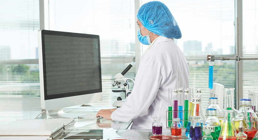 Pharma Lab Technician Using LIMS Software | 2026 harma lab technician using LIMS software at workstation